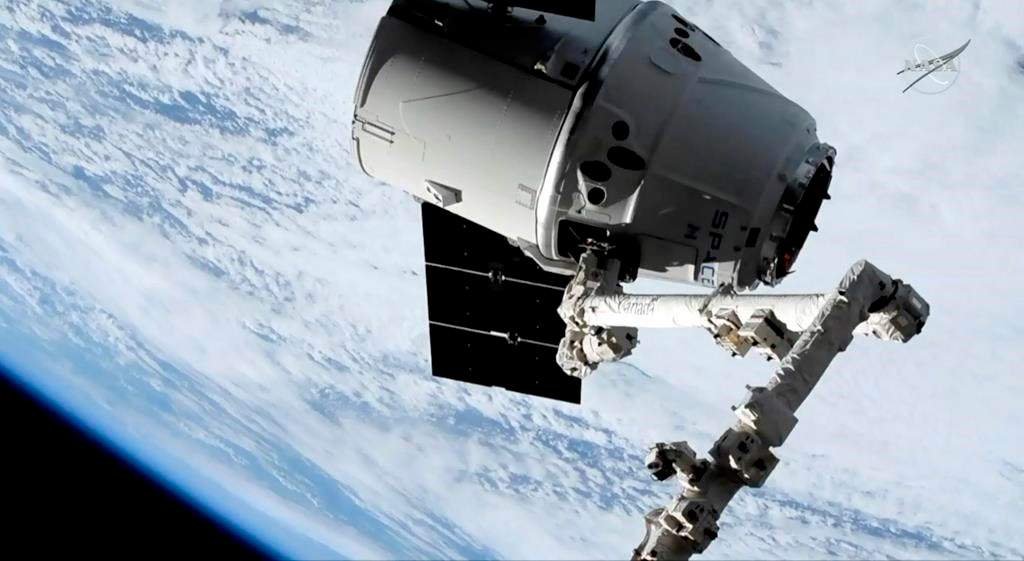 In this image taken from NASA Television, a SpaceX shipment prepares to arrive at the International Space Station following a weekend launch, Monday, May 6, 2019.
