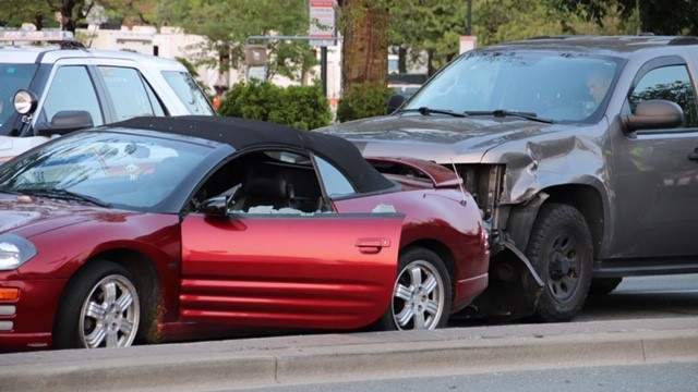 RCMP boxed in a car at 104 Avenue and King George Boulevard during a police pursuit early Friday.