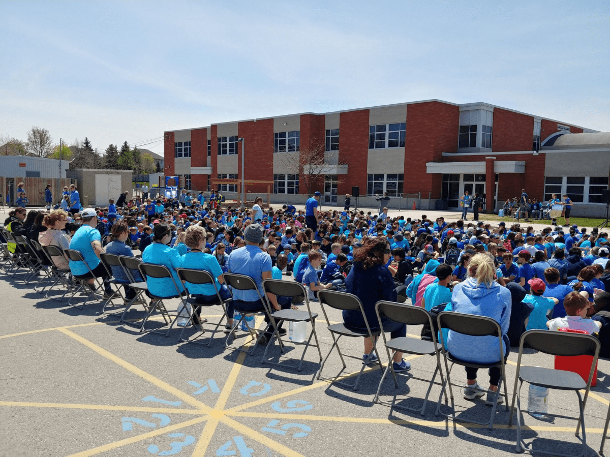 Students at St. Catherine of Siena gather outside the catholic school for the annual Water Walk in honour of the late Alex Foto.