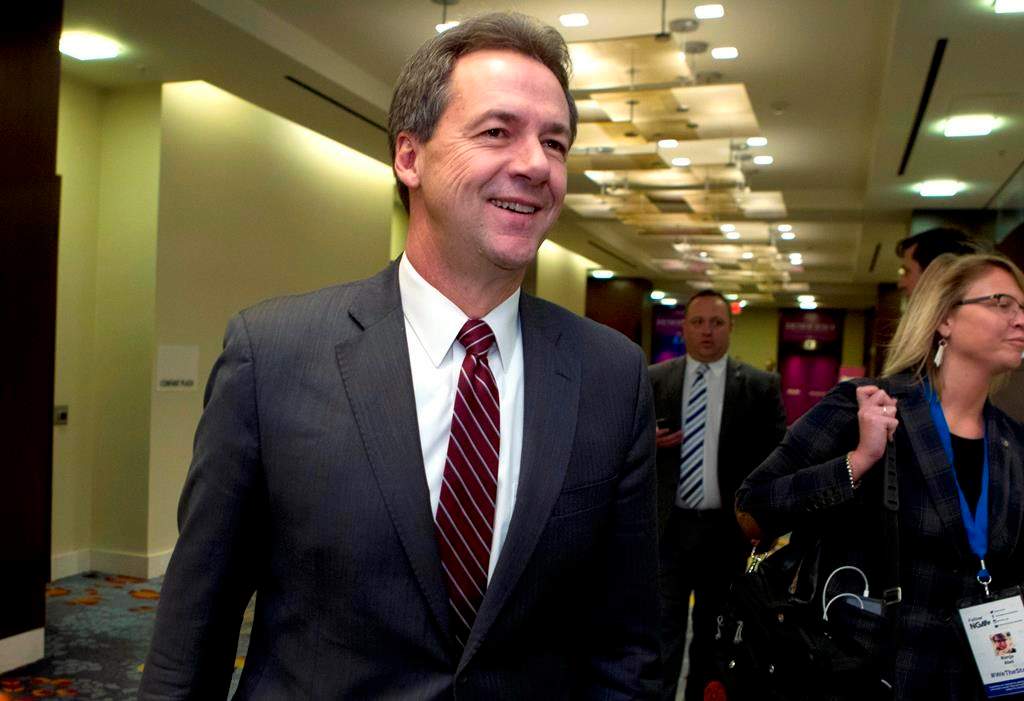 In this Feb. 23, 2019, file photo, Montana Gov. Steve Bullock walks to a meeting during the National Governors Association 2019 winter meeting in Washington.