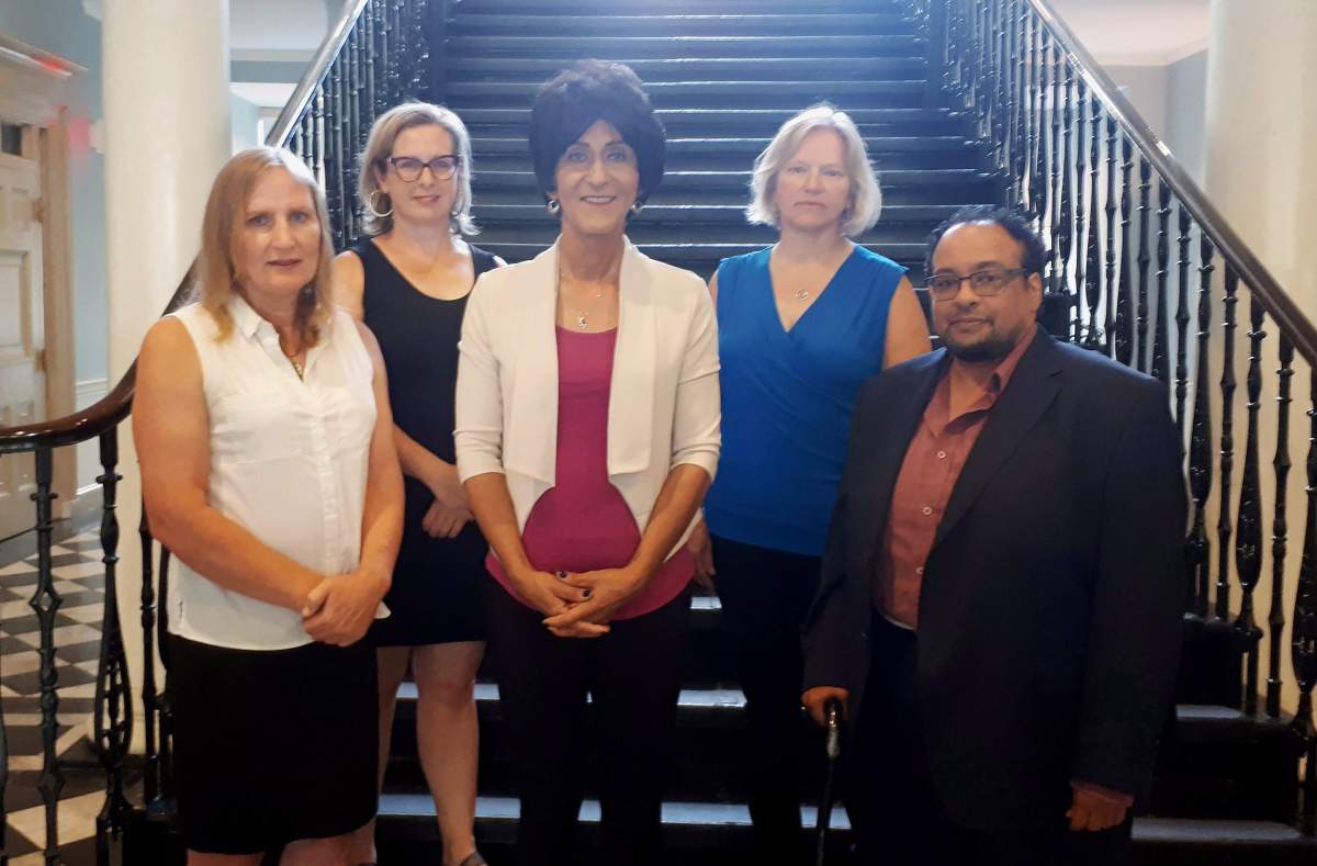 Left to right: Kate Shewan of the Youth Project, Nova Scotia NDP spokesperson for LGBTQ2 affairs Susan Leblanc, activist Serina Slaunwhite, lawyer Susanne Litke and activist Michael Davies-Cole pose at the legislature in Halifax on Thursday, Aug. 16, 2018.