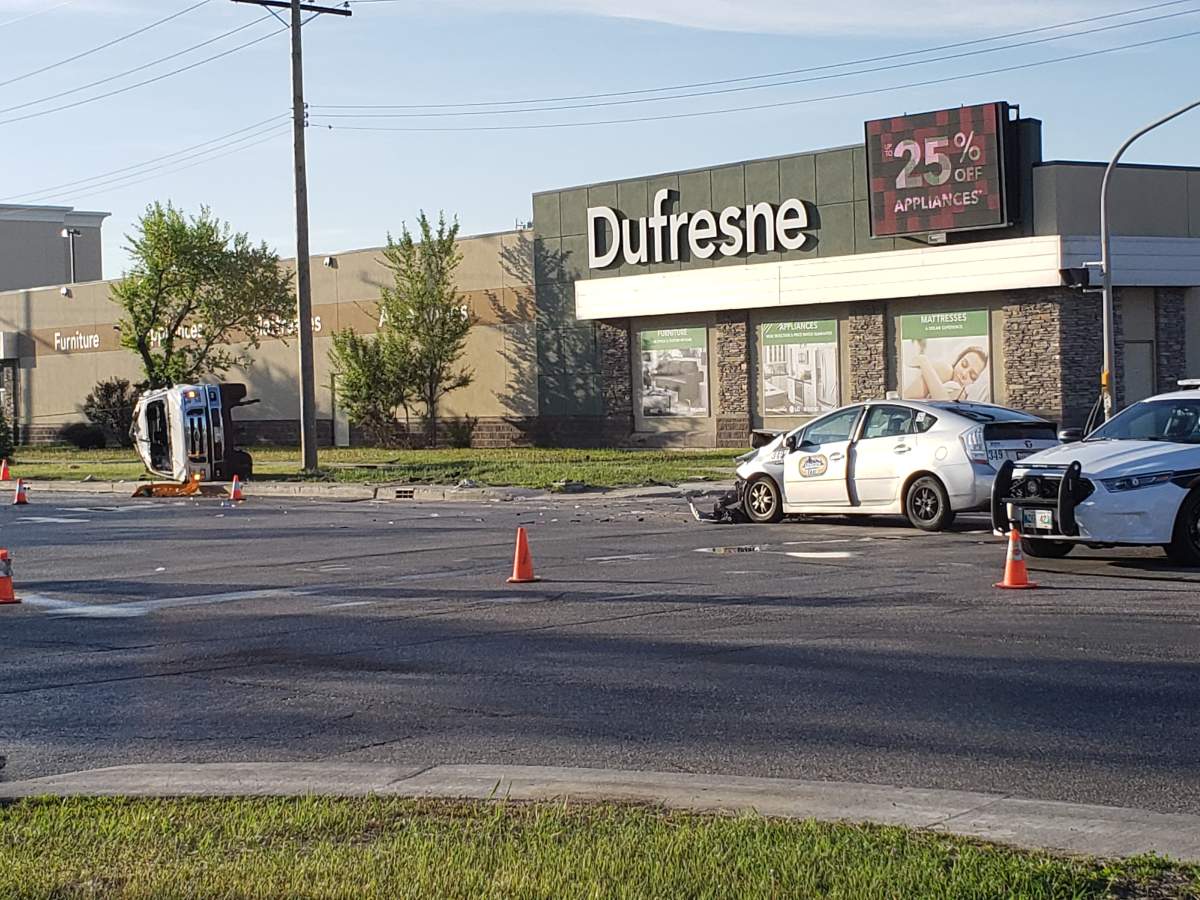 A light standard was knocked down in the collision between a truck and a taxicab Wednesday.