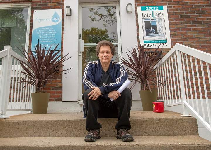 Richard Martin, who lives in a subsidized housing complex, sits in front of the social housing offices Wednesday, May 29, 2019 in Montreal. Montreal is about to introduce a new housing policy which will force condo developers to build more social and affordable housing for people like Martin.