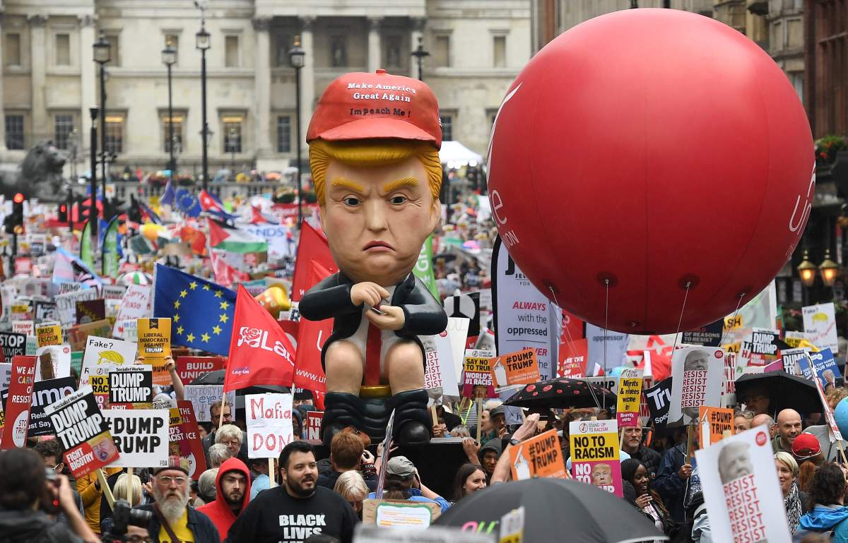 People march down Whitehall during an anti-Trump protest against U.S. President Donald J. Trump State visit to the UK at Trafalgar Square in London, Britain, 04 June 2019.