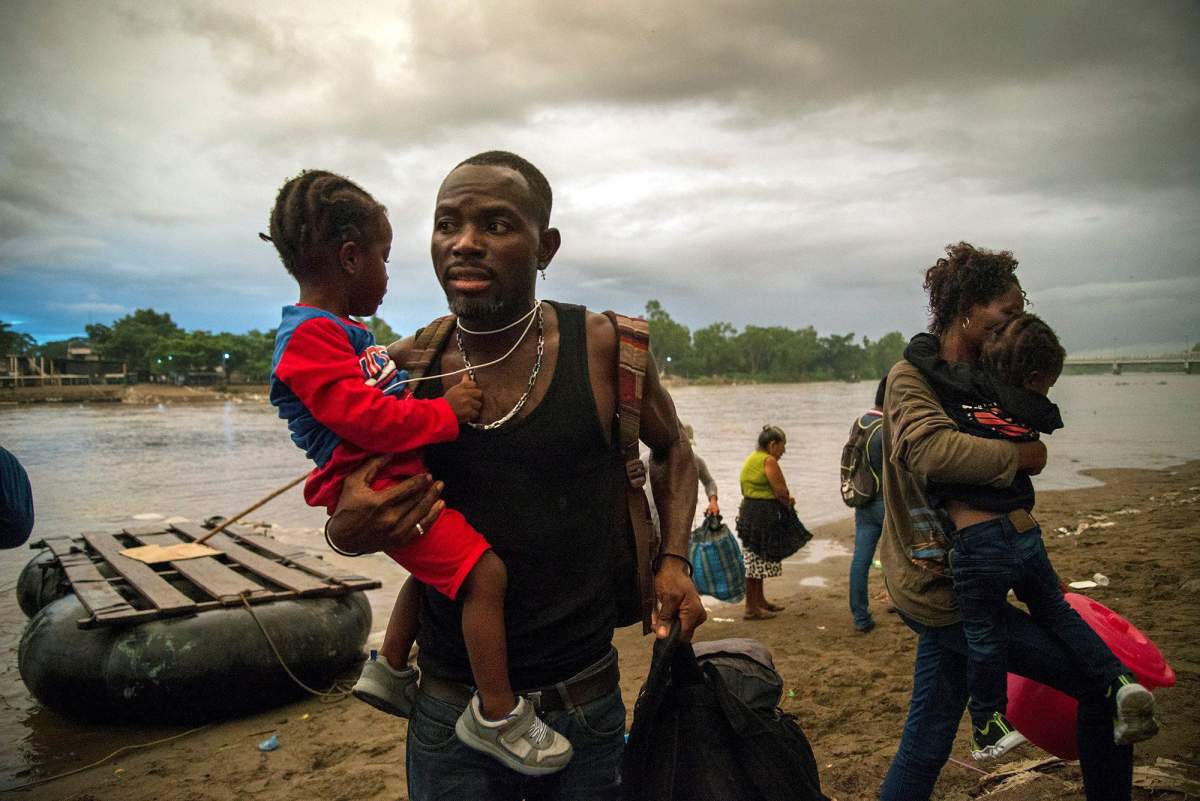 African migrants enter Mexican territory after crossing of the Suchiate River, which marks the border line with Mexico and Guatemala, in the state of Chiapas, Mexico, 02 June 2019 (issued 04 June). The flow of migrants along the Suchiate River, which separates Mexico from Guatemala, continues despite the reinforcement of Mexico's security measures and repeated threats from US President Donald Trump. It is six o'clock in the morning, and a group of people illegally cross this river, including people coming from Africa who flee away from their nations looking for a better future in Mexico and the United States.  