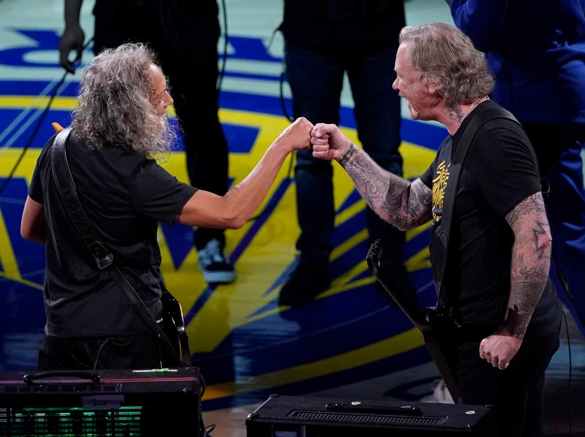 James Hetfield (R) and Kirk Hammett (L) perform the United States National Anthem prior to the NBA Finals game three between the Toronto Raptors and the Golden State Warriors at Oracle Arena in Oakland, Calif., on June 5, 2019.