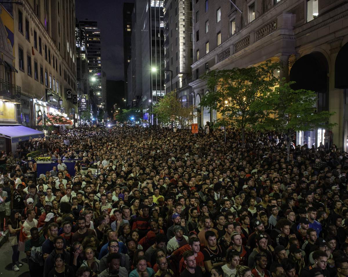 Fans watch Game 5 of the NBA Finals between the Toronto Raptors and the Golden State Warriors at a viewing party in Montreal on Monday, June 10, 2019. 