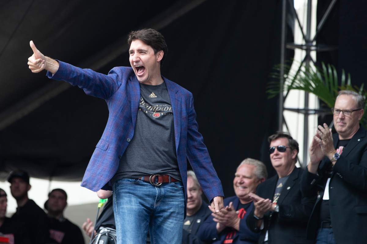 Prime Minister Justin Trudeau takes to the stage during the 2019 Toronto Raptors Championship parade in Toronto on Monday, June 17, 2019.