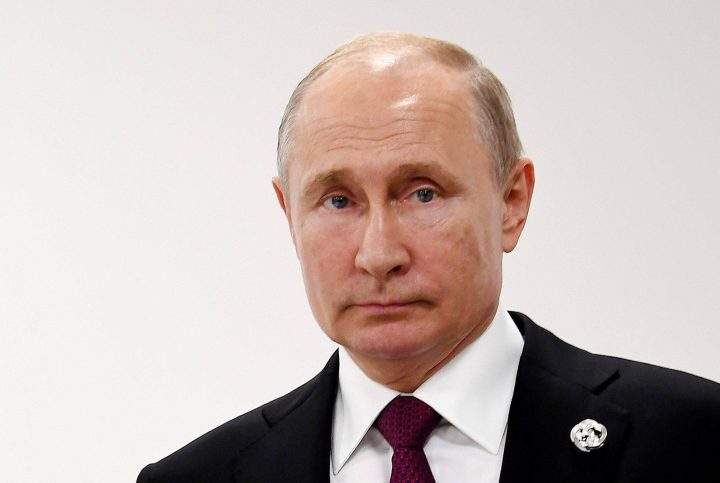 Russian President Vladimir Putin looks on during talks with British Prime Minister Theresa May on the first day of the G20 summit in Osaka, Japan, 28 June 2019. 