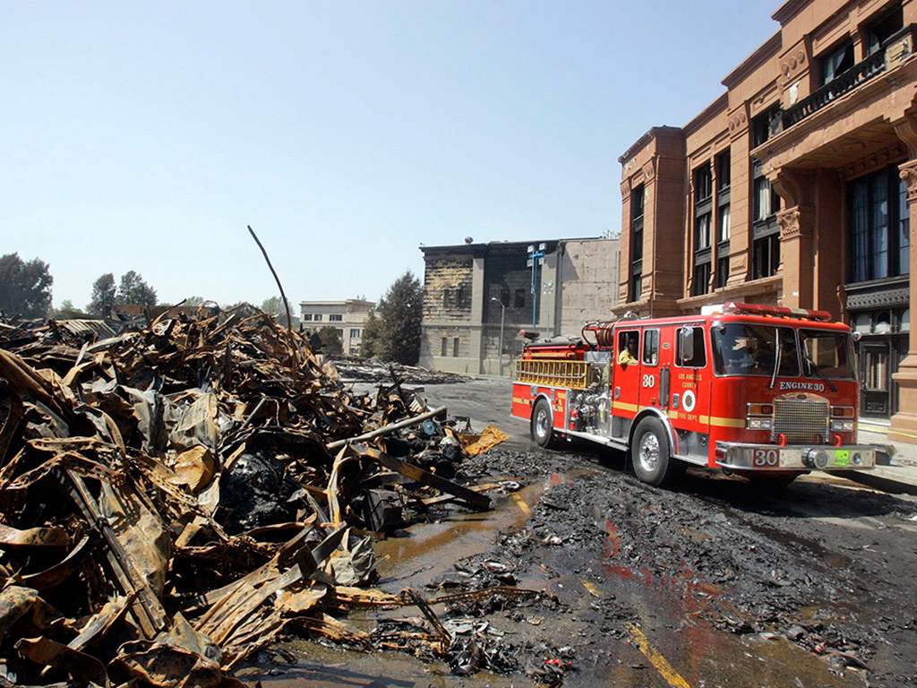 A Los Angeles County Fire truck passes a New York Street facade on Monday, June 2, 2008, at the Universal Studios Hollywood backlot, a day after a fire destroyed the sets of iconic films, in the Universal City section of Los Angeles, Calif.