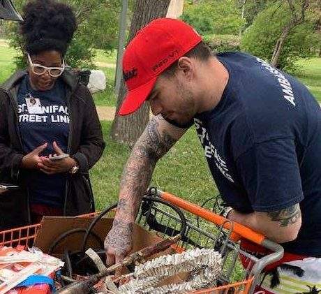 Street Links members sort through items found at Coronation Park on Tuesday.