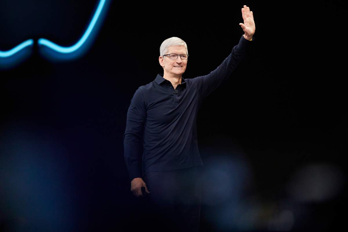 FILE - Tim Cook waves to the audience during Apple's WWDC 2019 developer conference.