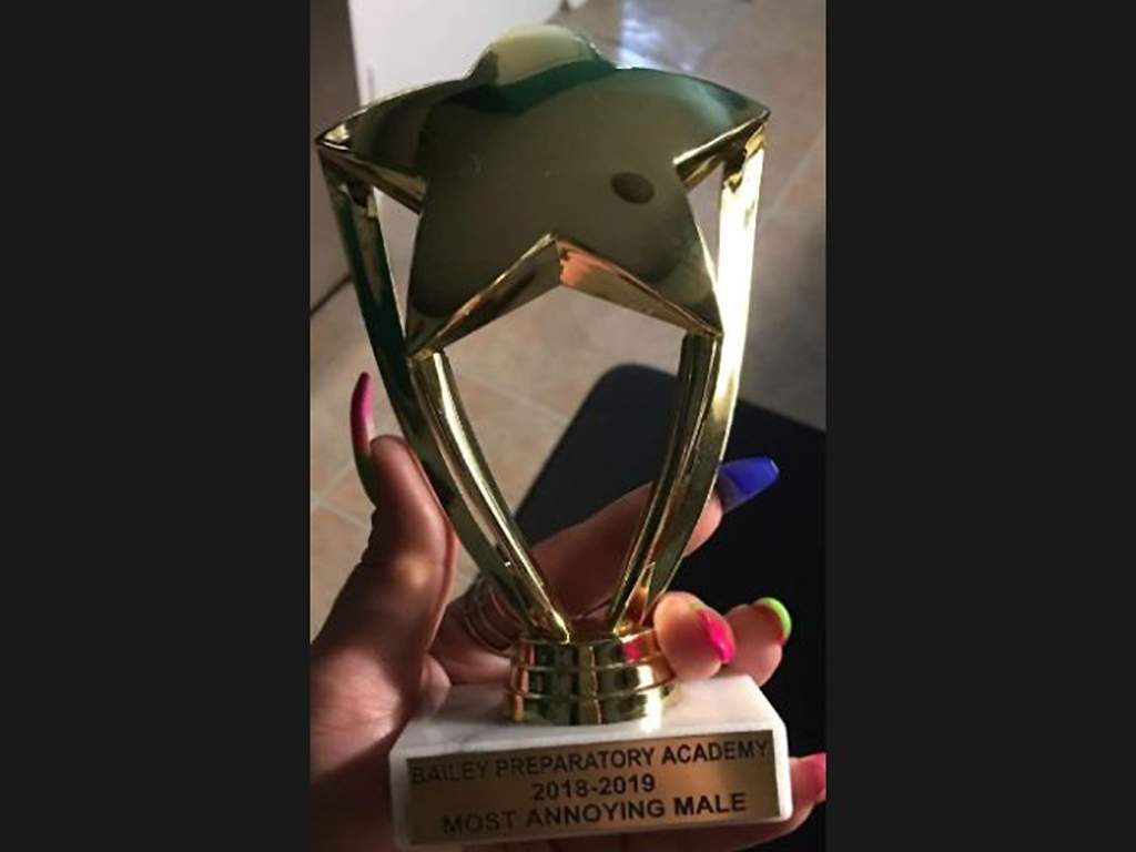 A trophy given to an Indiana boy with autism reads "Most Annoying Male.".
