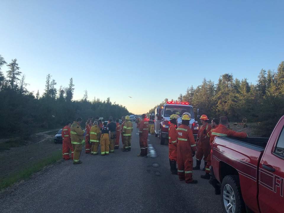 Bonnyville Regional Fire Authority firefighters and crews from Bonnyville, Glendon, La Corey and Iron River as well as Alberta Agriculture and Forestry at the scene of a wildfire near Bonnyville, Alta., on Tuesday, June 4, 2019. 