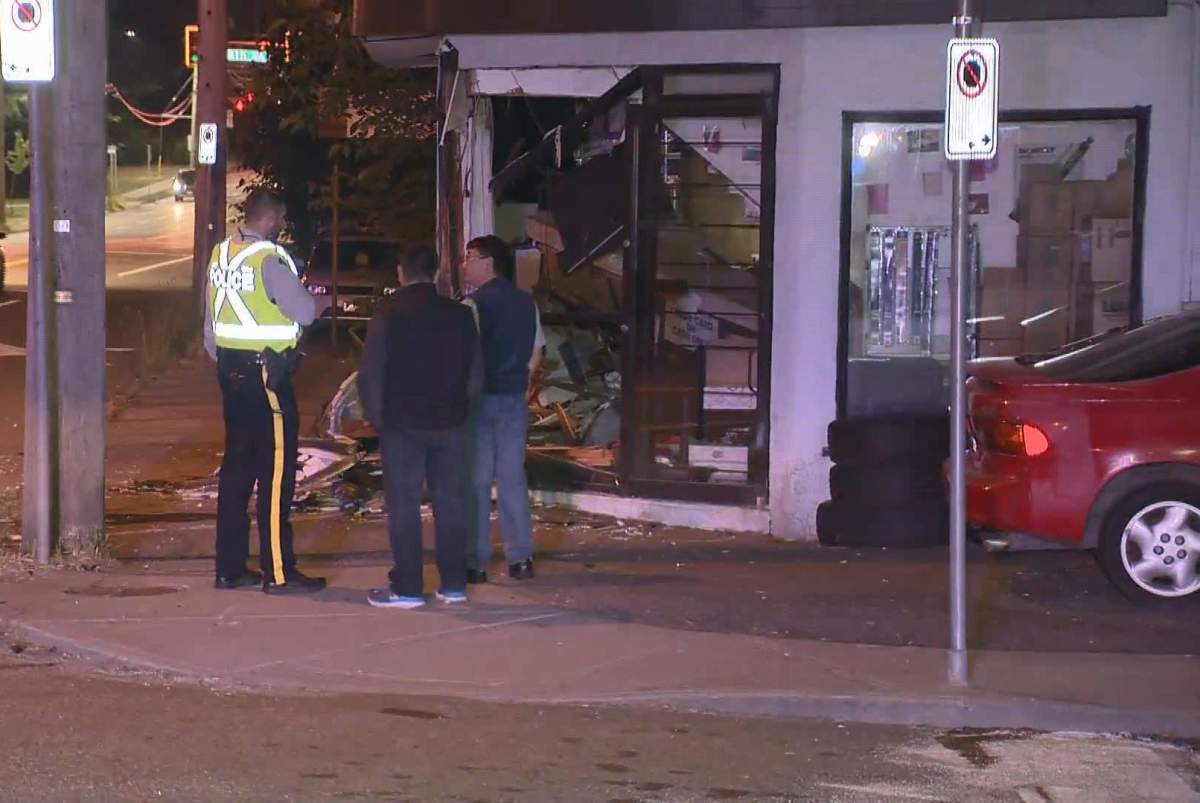 A storefront was heavily damaged after two cars collided in Burnaby early Sunday, June 16, 2019, sending one vehicle spinning into the front of Edmonds Motors. 
