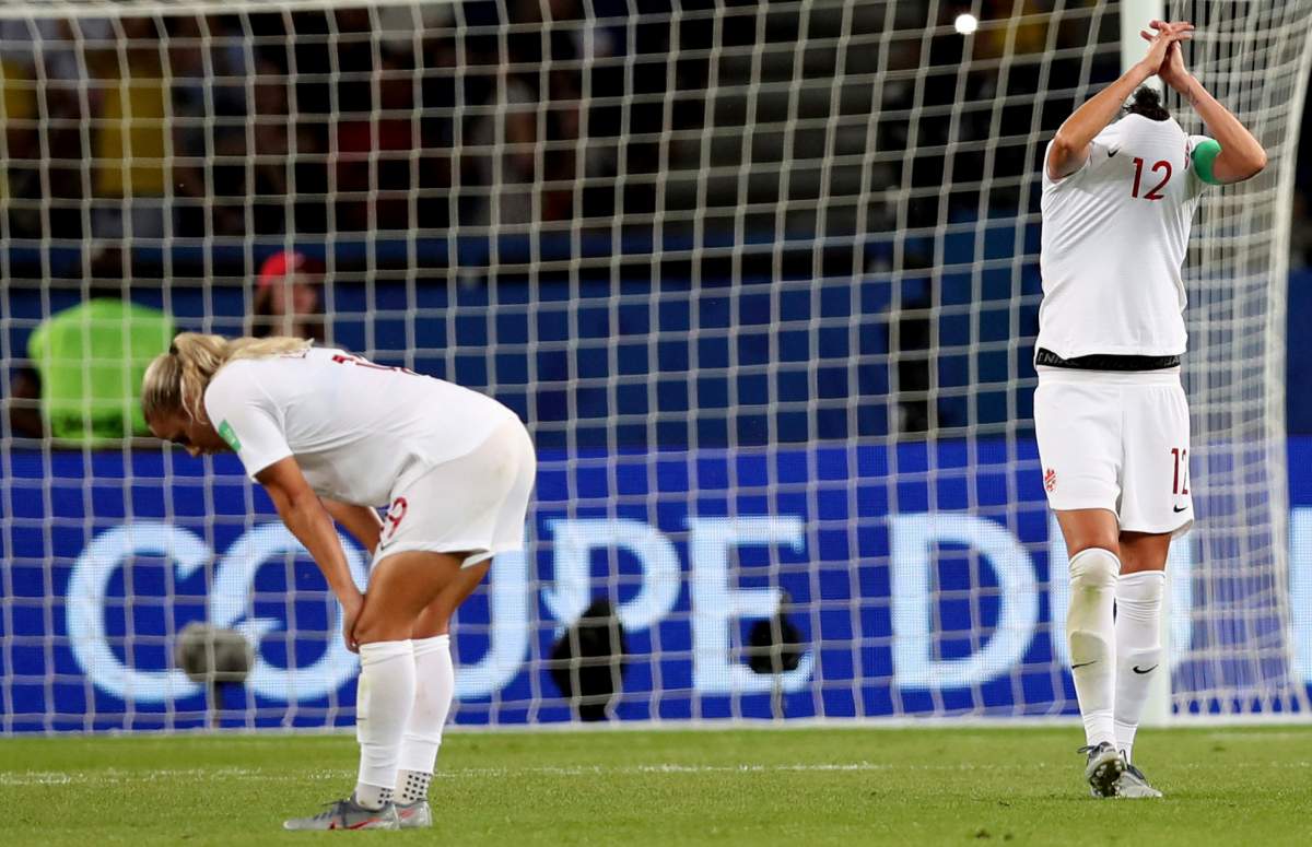 Canada's Christine Sinclair, right, reacts after team Canada lost their Women's World Cup round of 16 soccer match between Canada and Sweden at Parc des Princes in Paris, France, Monday, June 24, 2019.