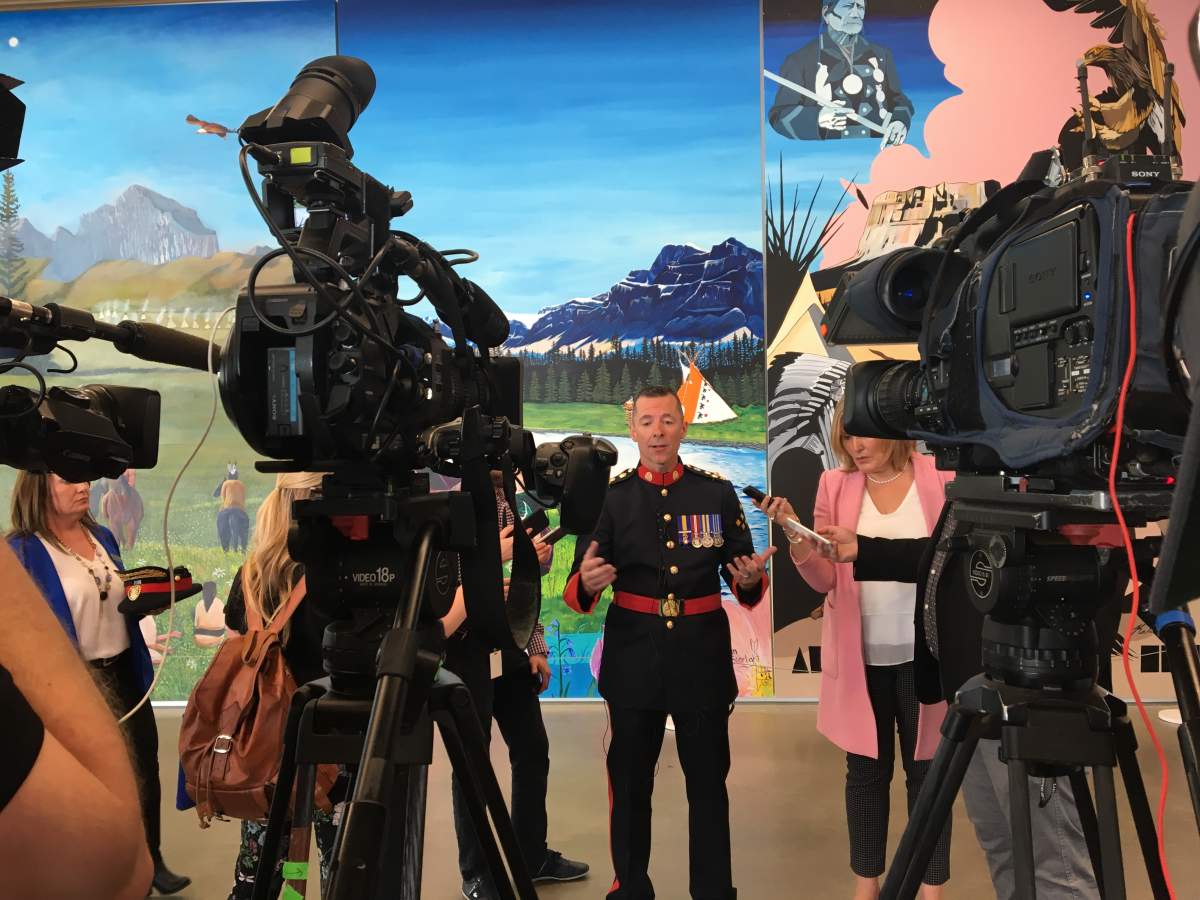Chief Mark Neufeld speaking to media.