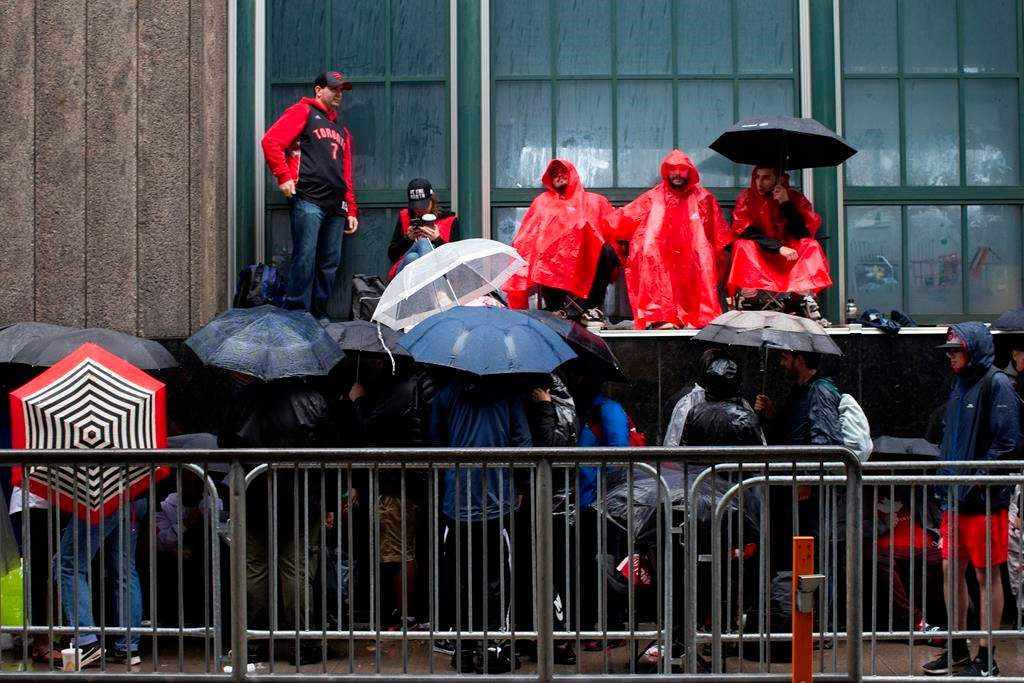 Toronto Raptors fans line up outside the Scotiabank Arena in Toronto on Monday, June 10, 2019, to gain access to Jurassic Park ahead of Game 5 of the NBA Finals. THE CANADIAN PRESS/Chris Young