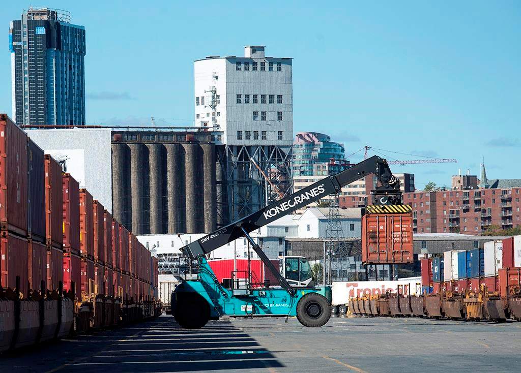 Shipping containers are moved at the Halterm Container Terminal in Halifax on Friday, Oct. 19, 2018. The site is now known as PSA Halifax.