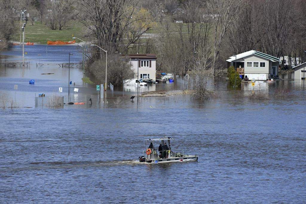 Homes along the Ottawa River in Gatineau, Que. are flooded on Tuesday, April 30, 2019.