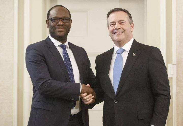 Alberta Premier Jason Kenney shakes hands with Minister of Municipal Affairs Kaycee Madu after being sworn into office in Edmonton on Tuesday April 30, 2019.