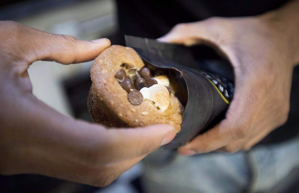 Yannick Craigwell shows off some of his edible marijuana baked treats in Vancouver, Wednesday, Oct. 3, 2018.