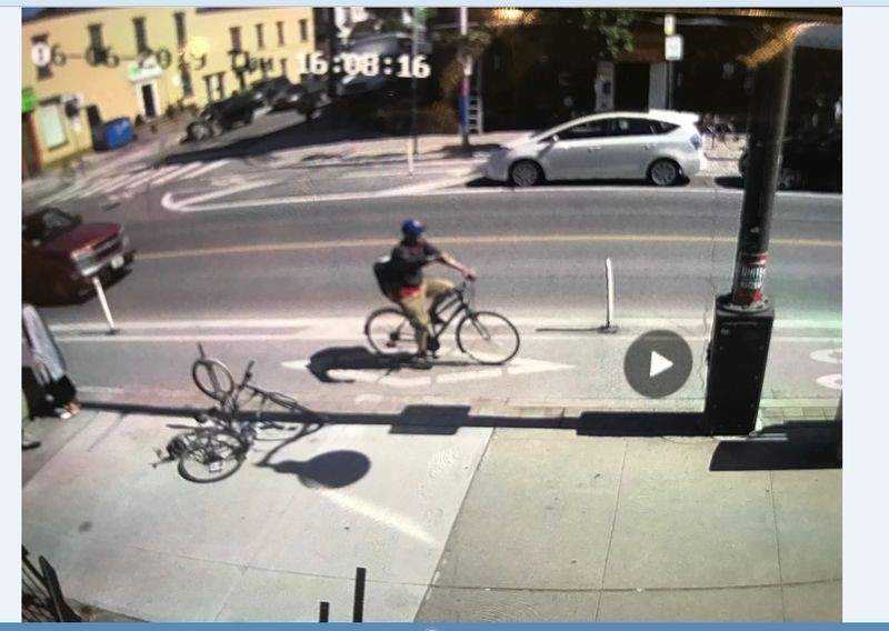 Toronto police say a cyclist has been arrested after he allegedly hurled a bottle of corrosive substance at a family with a baby. 