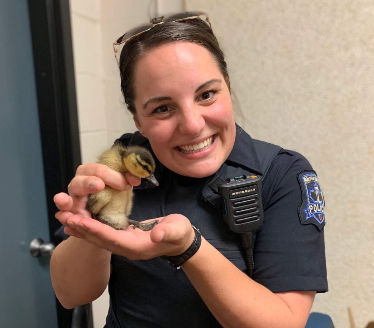 Halifax Regional Police Const. Alyssa Borutski holds Floop the duckling. 