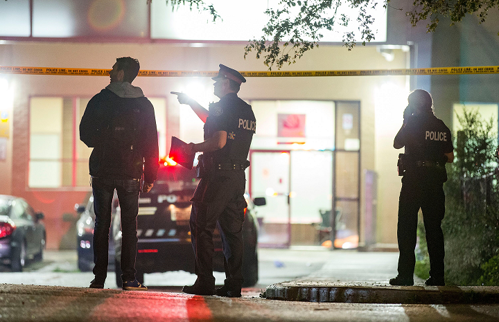 Toronto police on scene investigating after two men were found dead at a building on Emmett Avenue early Saturday.