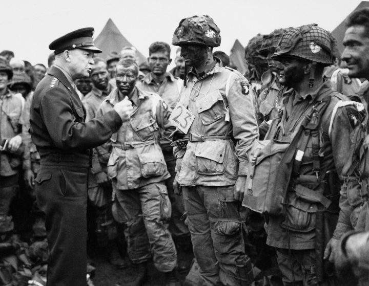 In this June 6, 1944, file photo, U.S. Gen. Dwight D. Eisenhower, left, gives the order of the day to paratroopers in England prior to boarding their planes to participate in the first assault of the Normandy invasion.