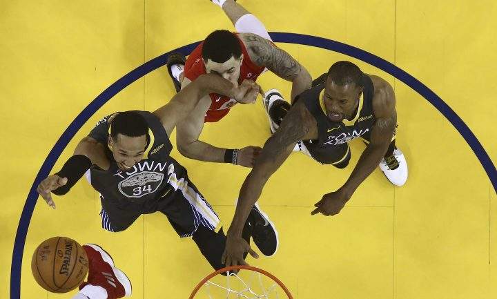 Toronto Raptors guard Fred VanVleet, top, is hit in the face by Golden State Warriors guard Shaun Livingston, left, during the second half of Game 4 of basketball’s NBA Finals in Oakland, Calif., Friday, June 7, 2019.