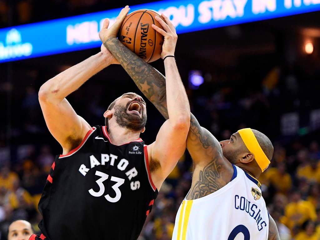 Toronto Raptors centre Marc Gasol,left and Golden State Warriors centre DeMarcus Cousins battle for the ball during second half basketball action in Game 3 of the NBA Finals in Oakland, California on Wednesday.