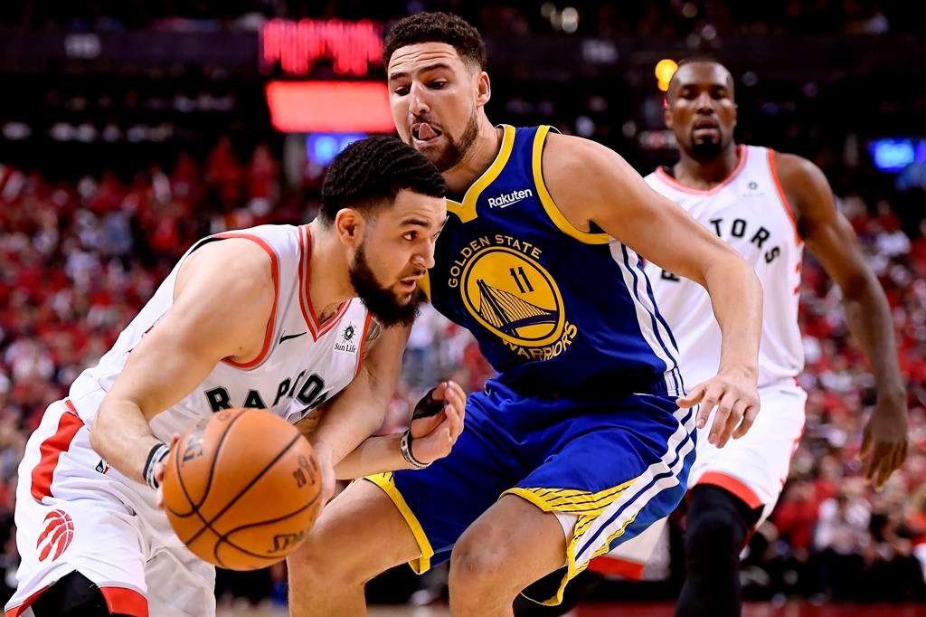Toronto Raptors guard Fred VanVleet (23) moves the ball around Golden State Warriors guard Klay Thompson (11) during second half Game 2 NBA Finals action, in Toronto on Sunday, June 2, 2019.