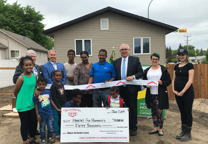 A partnership has built the biggest home through Prince Albert Habitat for Humanity, according to executive director Jan Thomas (far right).