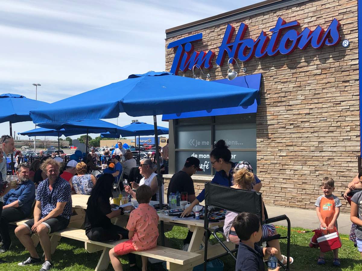 Activities at the Tim Hortons include face painting and musical performances.