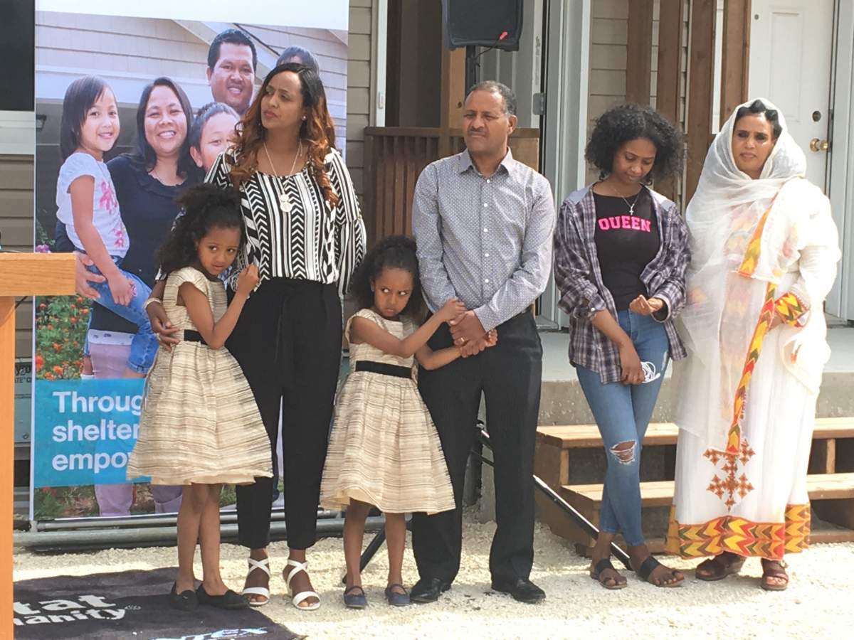 One of five families moving into a Habitat fr Humanity home on Logan Avenue: Senay and Luam, with their three kids Yedidya, Natan and Sara.