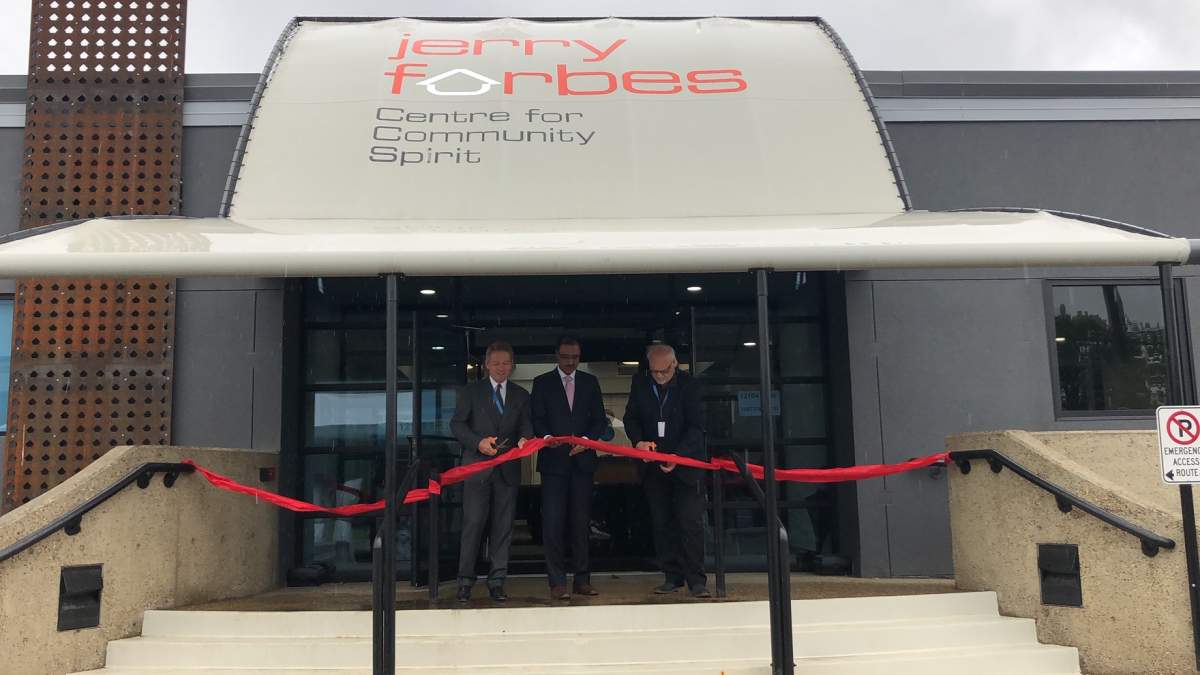 Board chair Brian Farrell, MP Amarjeet Sohi and Jerry Forbes' son Marty Forbes cut the ribbon at the grand opening of the Jerry Forbes Centre for Community Spirit on June 24, 2019.