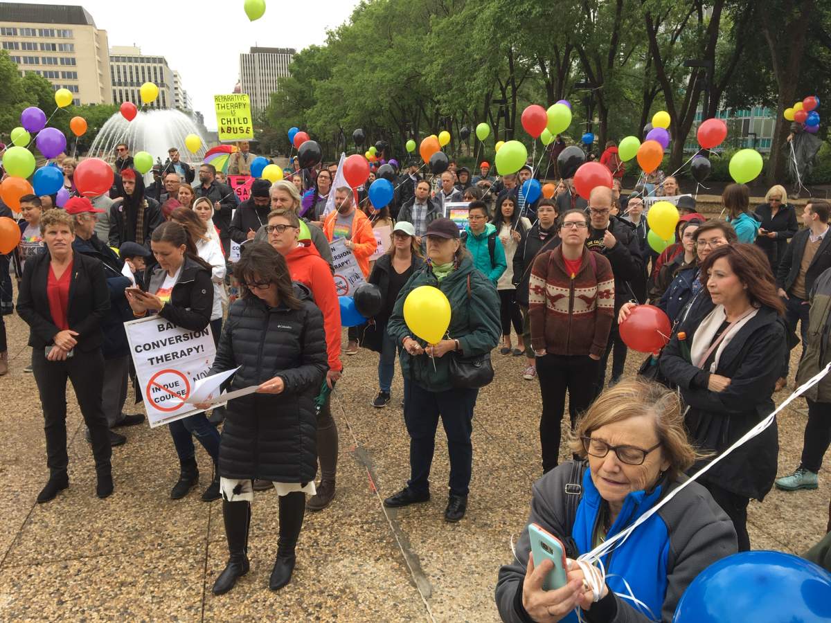Protesters from across Alberta gathered in Edmonton Thursday to support a provincial committee aimed at studying a potential conversion therapy ban.