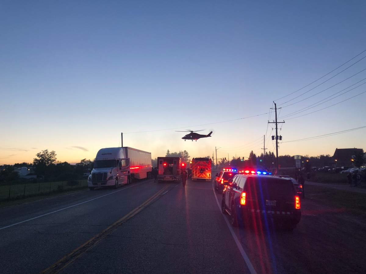 Provincial police say the pickup truck collided with an unoccupied transport. 