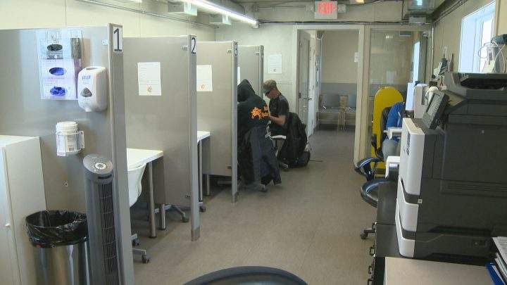 Two clients visit a temporary overdose prevention facility in Red Deer, Alberta in June, 2019