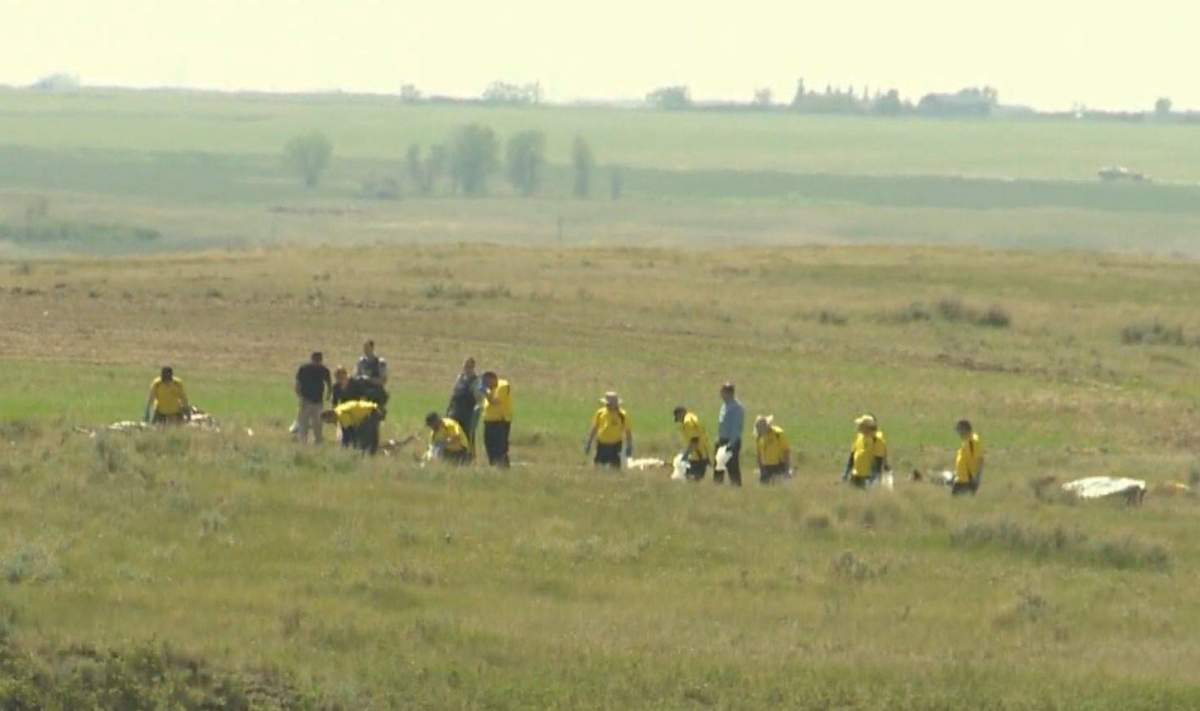 Investigators at the scene of a fatal plane crash near Irvine, Alta., on Sunday, June 2.