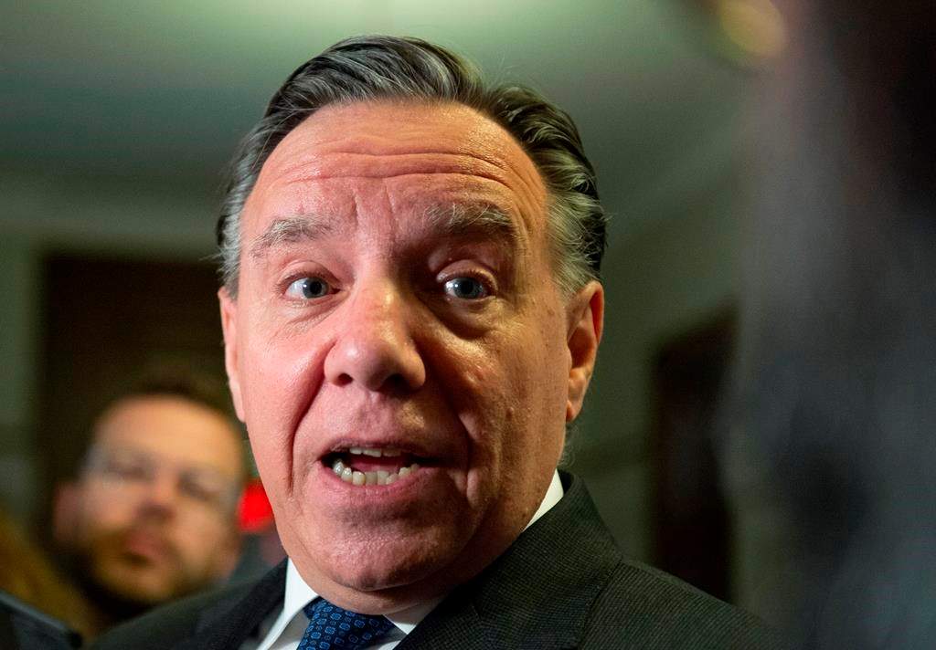 Quebec Premier François Legault responds to reporters' questions over his meeting with Alberta Premier Jason Kenney, Wednesday, June 12, 2019.