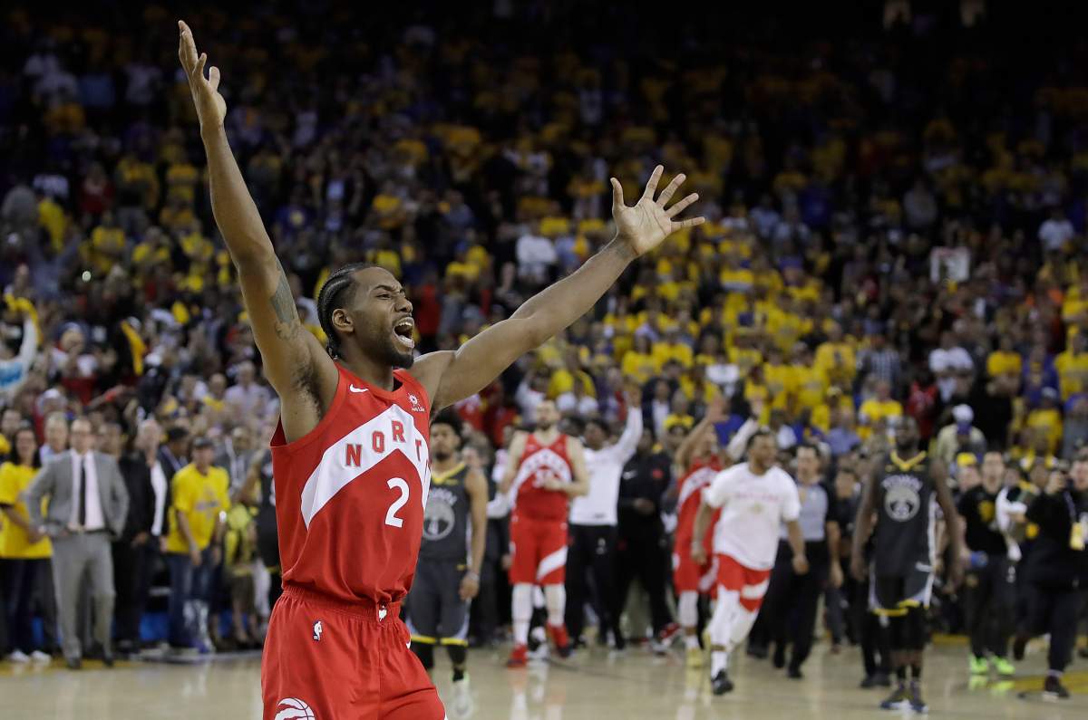 Toronto Raptors forward Kawhi Leonard celebrates after the Raptors defeated the Golden State Warriors in Game 6 of basketball's NBA Finals in Oakland, Calif., Thursday, June 13, 2019.