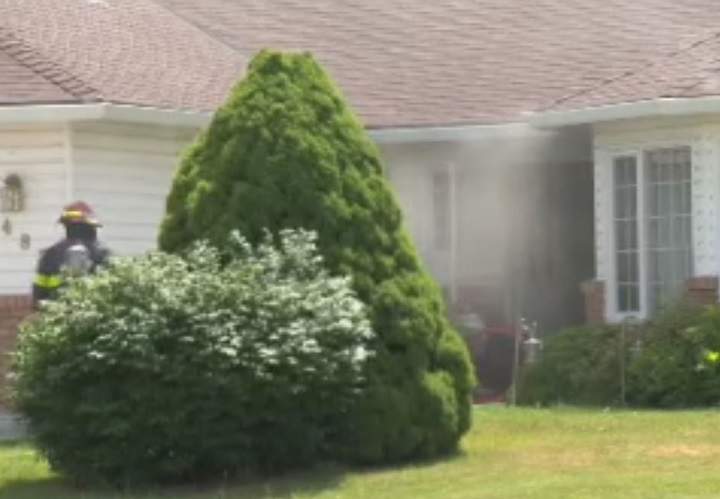 Smoke wafts from a home on Nelson Place in Kelowna after the fire fepartment extinguished a kitchen fire on Friday. 
