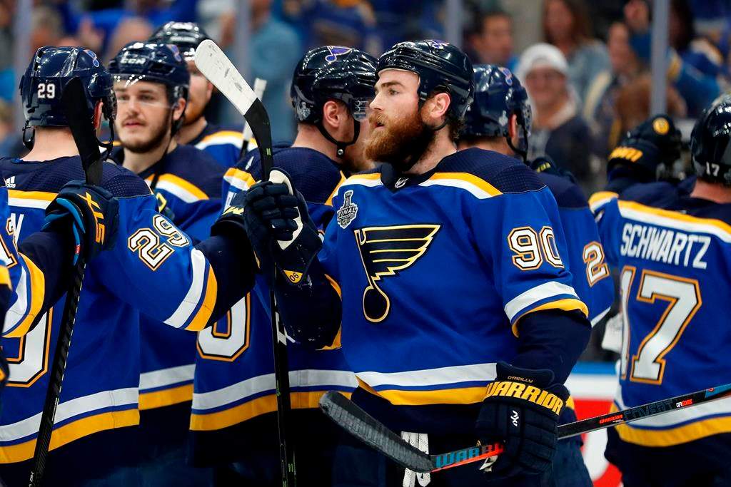St. Louis Blues center Ryan O'Reilly (90) celebrates after the Blues beat the Boston Bruins in Game 4 of the NHL hockey Stanley Cup Final Monday, June 3, 2019, in St. Louis. O'Reilly scored two goals as the Blues won 4-2 to tie the series 2-2. (AP Photo/Jeff Roberson).