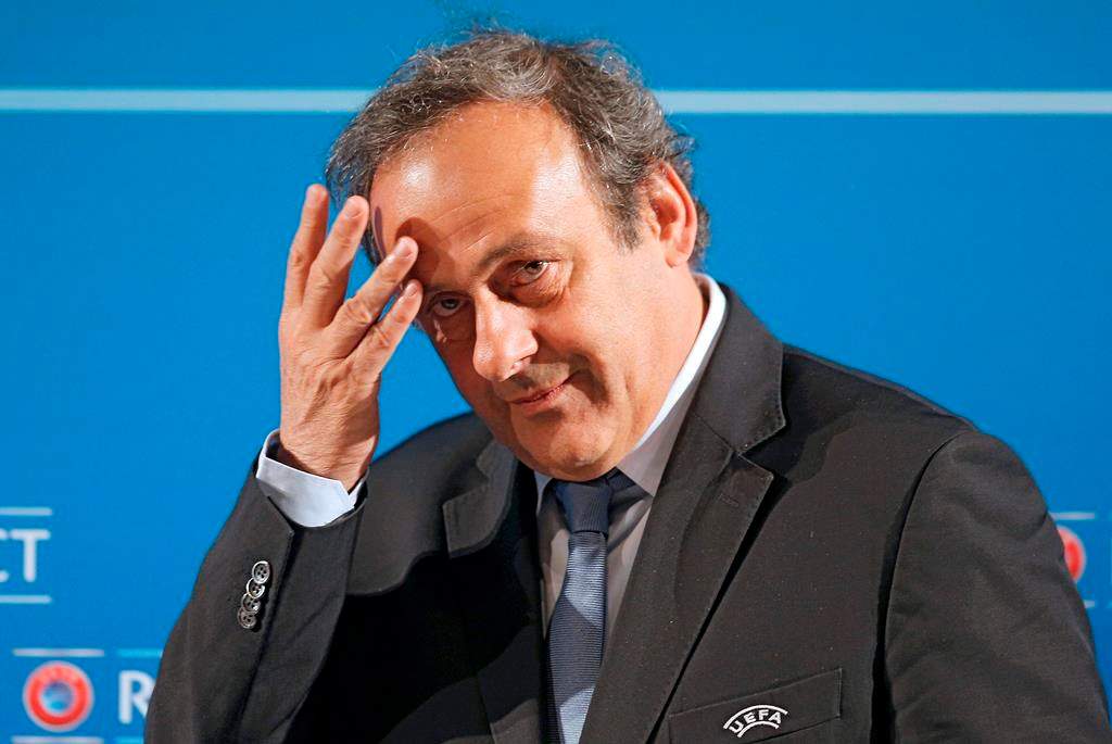 In this Feb.22, 2014 file photo, UEFA President Michel Platini arrives at a press conference, one day prior to the UEFA EURO 2016 qualifying draw in Nice, southeastern France.