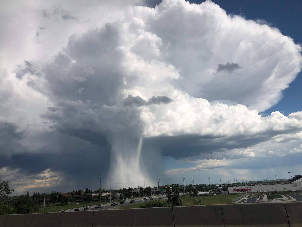 Photo of a cloudburst during a thunderstorm near Calgary, Alta. on Thursday, June 14, 2019. 
