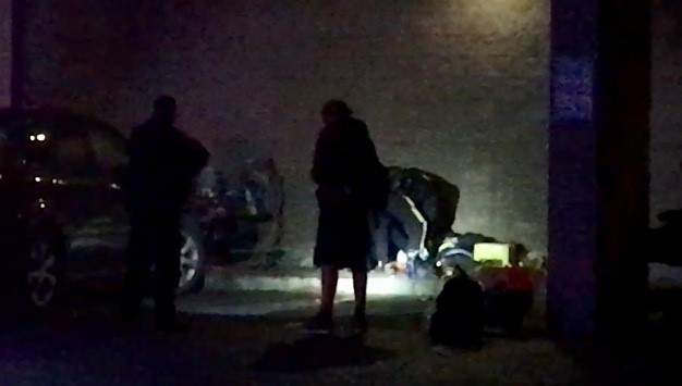 RCMP attend to a stabbing victim in downtown Kelowna on Thursday night.