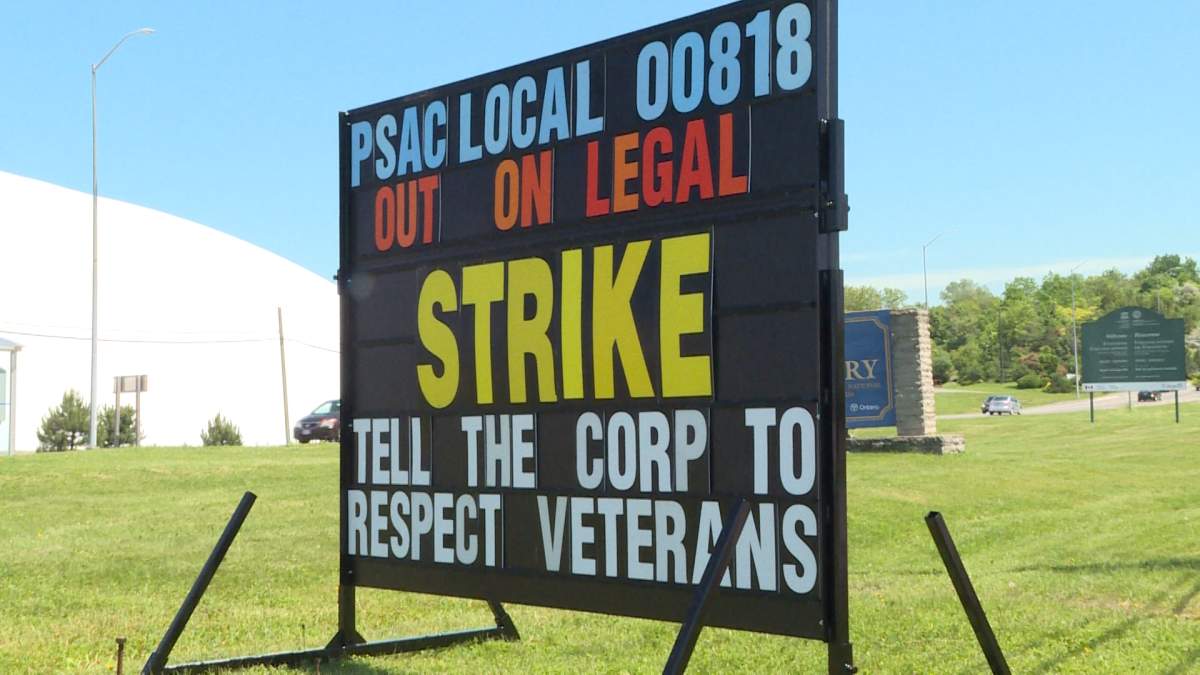 Commissionaires strike sign near Royal Military College in Kingston.