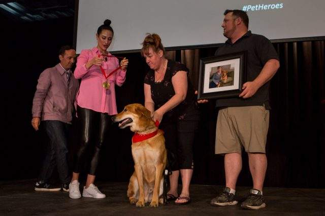 Tucker receives his medal during a ceremony in Toronto.